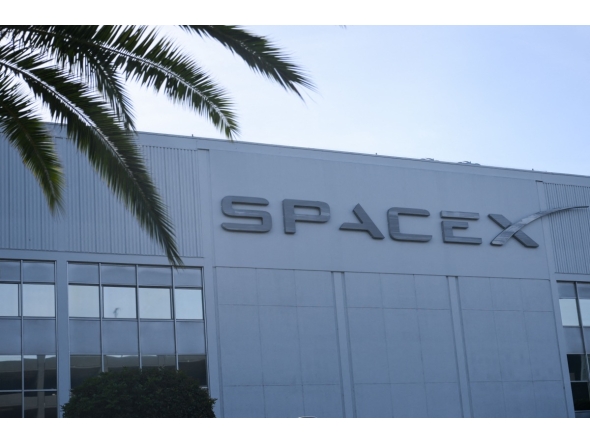 The SpaceX logo is displayed outside a Space Exploration Technologies Corp. facility in Hawthorne, California, on June 8, 2026. Photo by Patrick T. Fallon / AFP