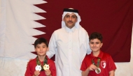 Qatar Chess Association Executive Director Hamad Al Tamimi with Mohammed Jarbi and Khalid Al Jumaat.