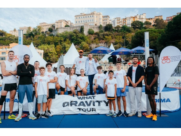 The participating high jumpers pose for a photo with junior athletes ahead of the event.
