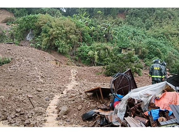 Rescuers work at a landslide site which hit a small restaurant burying three employees who had been in the kitchen, at a village in La Trinidad, Benguet province on August 6, 2026. Photo by AFP