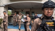 Police gather outside the house where a teenage suspect is suspected of killing his grandparents before carrying out a school shooting in Nonthaburi province, north of Thailand's capital Bangkok, on August 7, 2026. (Photo by Chanakarn LAOSARAKHAM / AFP)