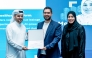 MCIT officials present a certificate to a programme participant.