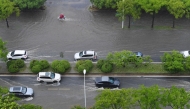Vehicles drive through a waterlogged street in Wuxi, east China's Jiangsu Province, Aug. 10, 2026. (Photo by Huan Yueliang/Xinhua)