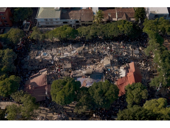 This aerial view shows a collapsed building after an earthquake in Cali, Colombia on August 10, 2026. Photo by JOAQUIN SARMIENTO / AFP
