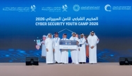 NCSA President Eng. Abdulrahman bin Ali Al Farahid Al Malki and Undersecretary of the Ministry of Education and Higher Education H E Dr. Ibrahim bin Saleh Al-Nuaimi honouring the participants during the Youth Cyber Security Camp at Raffles Hotel yesterday.