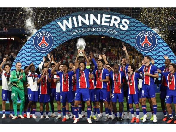 PSG players including Paris Saint-Germain's Brazilian defender #05 Marquinhos celebrate with the trophy after winning the UEFA Supercup football match between Champions League winners Paris Saint Germain (PSG) and Europa League winners Aston Villa in Salzburg, Austria on August 12, 2026. (Photo by FRANCK FIFE / AFP)