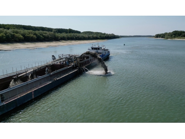 An aerial view shows a dredger deployed to deepen the navigable channel due to the low level of Danube near Capidava village, on August 12, 2026.(Photo by Daniel MIHAILESCU / AFP) 