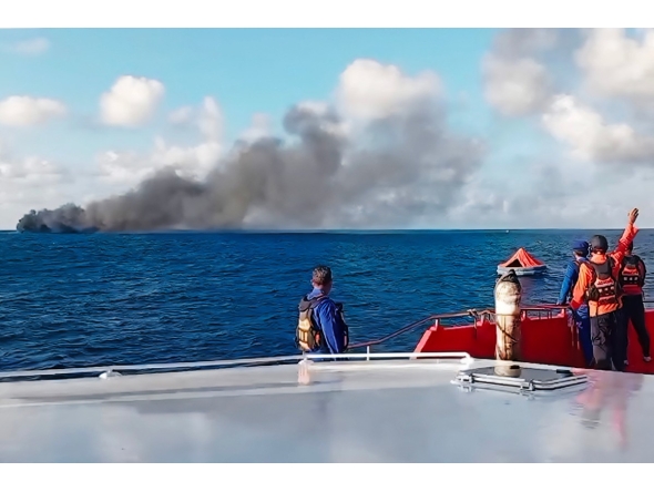 This screen grab picture from a handout video taken and released on August 12, 2026 by the Indonesian National Search and Rescue Agency (Basarnas) shows the Putri Yasmin ferry, which serves the Padangbai-Bali- to Lembar-West Nusa Tenggara route, on fire in the waters of Bali. (Photo by Handout (Green Road Waste Management )