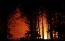 Firefighters battle a wildfire in the Landes forest in Luglon, south-western France, on August 13, 2026. Photo by ROMAIN PERROCHEAU / AFP