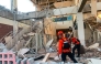 This handout picture taken and released on August 15, 2026 by Indonesia's National Search and Rescue Agency (BASARNAS) shows rescuers working amid the rubble of a damaged building after an earthquake in Maumere, East Nusa Tenggara. (Photo by Handout / INDONESIA'S NATIONAL SEARCH AND RESCUE AGENCY (BASARNAS) / AFP)