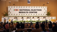 Electoral Commission of Zambia chairperson Mwangala Zaloumis (back row 3rd R) addresses the nation at the 2026 National Election Results Centre in Lusaka on August 14, 2026. Zambia resumed vote counting on August 14 after a nationwide suspension over violence raised tensions nationwide. (Photo by GIANLUIGI GUERCIA / AFP)