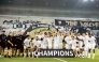 Al Sadd players and officials celebrate after winning Al Ahrar Cup.
