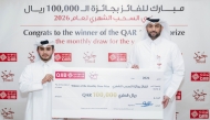QIIB’s Head of Products, Talal al-Jaidah, presenting the winner, Mooza Saleh ALhumaidi with a cheque during the ceremony.