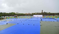 A general view shows covered ground as rain delays the start of play on second day of the first Test cricket match between Sri Lanka and India at the Galle International Stadium in Galle on August 16, 2026. (Photo by Ishara S. KODIKARA / AFP)