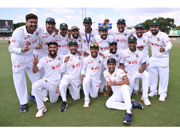 Bangladesh players pose for a photo after their team's victory on the fourth day of the first cricket Test match between Australia and Bangladesh at Marrara Stadium in Darwin on August 16, 2026. (Photo by William WEST / AFP)