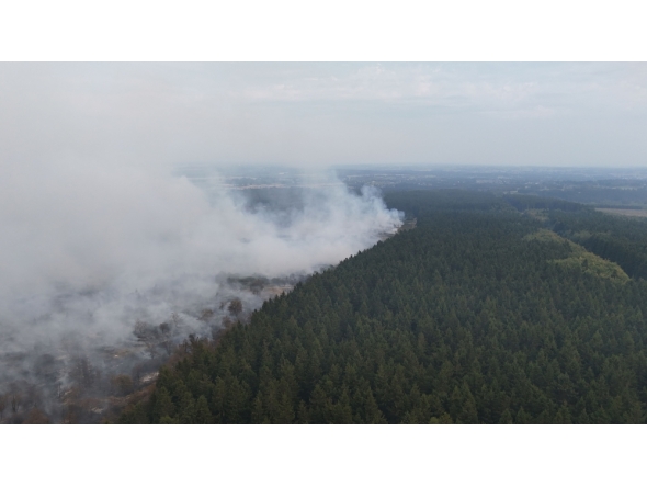 This aerial photograph shows a wildfire burning in the Hautes Fagnes (High Fens) nature reserve in Waimes on August 15, 2026. (Photo by Dimitri KORCZAK / AFP)