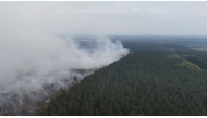 This aerial photograph shows a wildfire burning in the Hautes Fagnes (High Fens) nature reserve in Waimes on August 15, 2026. (Photo by Dimitri KORCZAK / AFP)