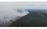 This aerial photograph shows a wildfire burning in the Hautes Fagnes (High Fens) nature reserve in Waimes on August 15, 2026. (Photo by Dimitri KORCZAK / AFP)