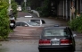 Abandoned cars partially submerged on a flooded road in Chiba prefecture. AFP file photo.