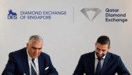 QDE Director, Ghanim Nasser Al-Saadi, and President of the Diamond Exchange of Singapore, Fabio Cascapera, signing the agreement