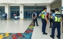 Philippine police gather at a school following a shooting in Zamboanga on August 18, 2026. A student was shot dead at a high school in the southern Philippines on August 18 before the alleged killer took his own life, police said. (Photo by Roel Parreno / AFP)