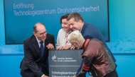 (L-R) German Interior Minister Alexander Dobrindt, German Minister for Research, Technology and Aerospace Dorothee Baer, Saxony-Anhalt's State Premier Sven Schulze and the Chairwoman of the DLR Executive Board Anke Kaysser-Pyzalla take part in the opening of the new Drone Safety Technology Center at the Cochstedt site of the German Aerospace Center (DLR), eastern Germany on August 18, 2026. (Photo by Ronny HARTMANN / AFP)