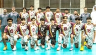 Qatar U-17 players and officials pose for a photo.