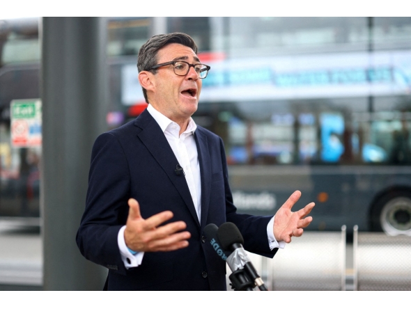 Britain's Prime Minister Andy Burnham speaks to the media, during his visit to Wolverhampton Bus Station, in Wolverhampton, central England on August 18, 2026. (Photo by Hannah McKay / AFP)