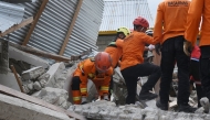 This handout picture taken and released on August 19, 2026 by Indonesia's Search and Rescue Agency (BASARNAS) shows rescue personnel from the agency working at the scene of a collapsed building in East Manggarai following a 7.7-magnitude earthquake that struck Indonesia's Flores island on August 15. Photo by Handout / INDONESIA'S NATIONAL SEARCH AND RESCUE AGENCY (BASARNAS) / AFP