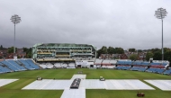 The covers stay on the pitch as rain delays the start of day two of the first Test match between England and Pakistan at Headingley cricket ground in Leeds, northern England on August 20, 2026. (Photo by Darren Staples / AFP) 