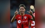 Al Rayyan's Gabriel Pereira celebrates after scoring a goal. RIGHT: Al Rayyan's Roger Guedes (right) in action during a match against Lusail at Ahmad Bin Ali Stadium yesterday. 