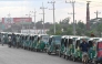 This photograph taken on August 12, 2026 shows CNG-powered autorickshaws waiting for long hours to refuel in Bangladesh's Brahmanbaria district. (Photo by Salahuddin Ahmed / AFP)