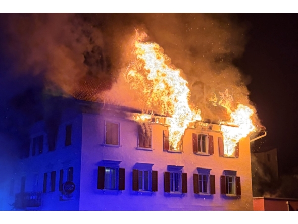 This handout photograph taken and released on August 21, 2026 by the Cantonal Police of Graubunden (Kantonspolizei Graubunden) shows a fire that broke out in a building in the small town of Thusis, eastern Switzerland. Photo by HANDOUT / KANTONSPOLIZEI GRAUBÜNDEN / AFP