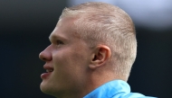 Manchester City's Norwegian striker #09 Erling Haaland, sporting a new hair cut, warms up ahead of the English Premier League football match between Manchester City and AFC Bournemouth at the Etihad Stadium in Manchester, north west England, on August 23, 2026. (Photo by Darren Staples / AFP) 