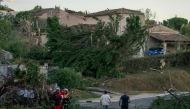 This photograph taken on August 24, 2026, shows damaged houses and toppled trees after a tornado struck Pomas, southwestern France. (Photo by Idriss Bigou-Gilles / AFP)