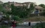 This photograph taken on August 24, 2026, shows damaged houses and toppled trees after a tornado struck Pomas, southwestern France. (Photo by Idriss Bigou-Gilles / AFP)
