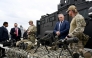 Australian Defence and Border Force officials brief Canadian Minister of Public Safety Gary Anandasangaree (L), US Secretary of Homeland Security Markwayne Mullin (2nd L), and New Zealand Police Minister Mark Mitchell (2nd R) on sniper rifles during a capability demonstration on Garden Island in Sydney on August 26, 2026, at an event held as part of the Five Country Ministerial (FCM) meeting. (Photo by Saeed KHAN / AFP)