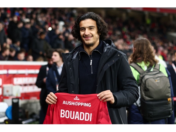 Lille's French midfielder #32 Ayyoub Bouaddi poses for a photograph with a jersey reading 
