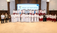 Team Qatar athletes and QOC officials pose for a group photo. 
