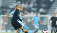 Al Rayyan's Roger Guedes (foreground) in action during match against Al Wakrah.
