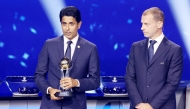 PSG President Nasser Al-Khelaifi (left) speaks after receiving an award from UEFA President Aleksander Ceferin during the draw ceremony yesterday. 