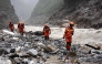 Fire and rescue personnel conduct search and rescue operations 2 kilometers from Gyirong Port days after the August 26 mudslide which destroyed the port, in Gyirong County, in China western Tibet region on August 29, 2026. (Photo by CNS / AFP) 