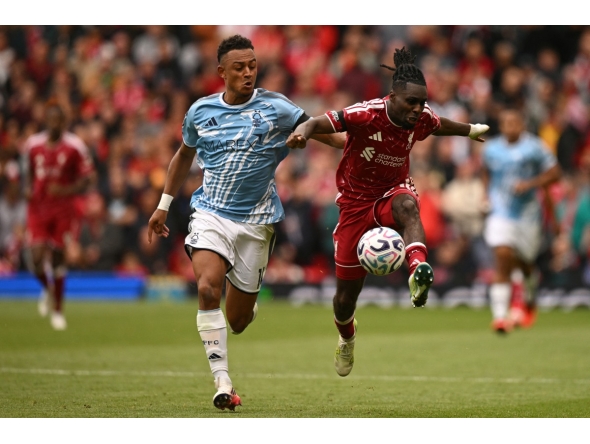 Nottingham Forest's Swiss midfielder #11 Dan Ndoye (L) vies with Liverpool's Dutch defender #30 Jeremie Frimpong (R) during the English Premier League football match between Liverpool and Nottingham Forest at Anfield in Liverpool, north west England on August 29, 2026. (Photo by Oli SCARFF / AFP)