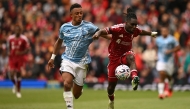 Nottingham Forest's Swiss midfielder #11 Dan Ndoye (L) vies with Liverpool's Dutch defender #30 Jeremie Frimpong (R) during the English Premier League football match between Liverpool and Nottingham Forest at Anfield in Liverpool, north west England on August 29, 2026. (Photo by Oli SCARFF / AFP)