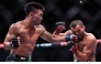 Song Yadong (L) of China competes against Umar Nurmagomedov of Russia during the UFC Fight Night Bantamweight Bout (Main Event) 5 Rounds at the Oriental Sports Center in east China's Shanghai, Aug. 29, 2026. (Xinhua/Li Ming)