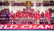 Iran players celebrate with the trophy after beating France in the final.