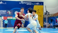 Action during the semi-final between Qatar and Republic of Korea. 