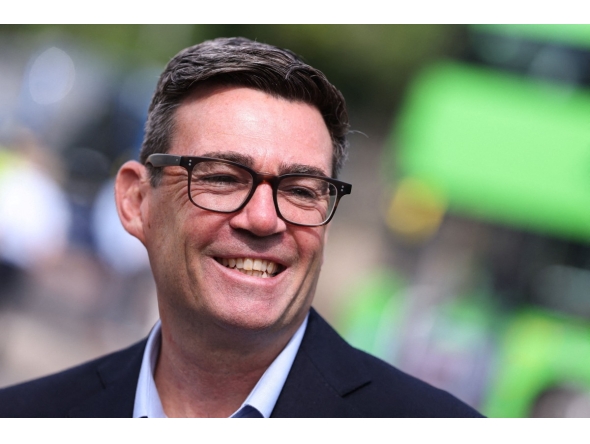Britain's Prime Minister Andy Burnham smiles during a visit to Bath, western England, on July 22, 2026. Photo by Toby Melville / POOL / AFP