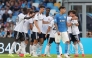 Como's Greek striker #09 Anastasios Douvikas (hidden) celebrates scoring his team's second goal during the Italian Serie A football match between Napoli and Como at the Diego Armando Maradona stadium in Naples on August 30, 2026. (Photo by Carlo Hermann / AFP)