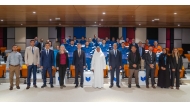 UDST President Dr. Salem Al-Naemi with officials, professors and young professionals from Uzbekistan during the completion of a 10-month vocational training programme.